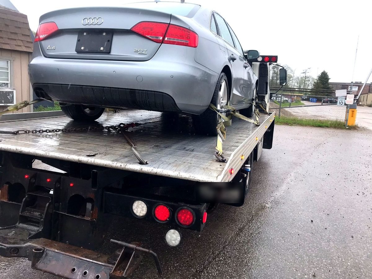 Audi A4 loaded on the deck after a cash for cars pickup